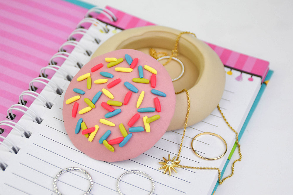 Professional studio photo of a finished Sculpey polymer clay craft.