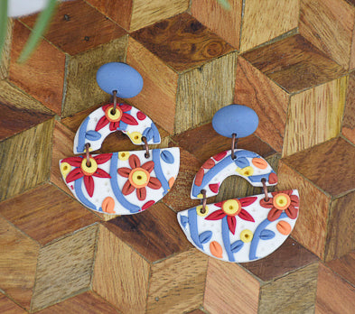 Gold Slab Building for Earrings with pink earring on it