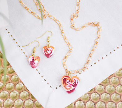 Gold Hearts for Everyone necklace and earrings with a pink marble pendants