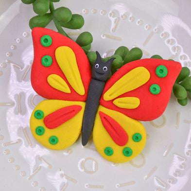 Red and Yellow Bendy Butterfly with green detail