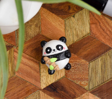 Black and White Panda Charm holding bamboo