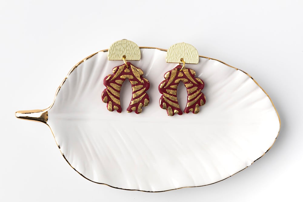 large final image for Sculpey Soufflé™ Cabernet and Gold Leaf Stencil Earrings